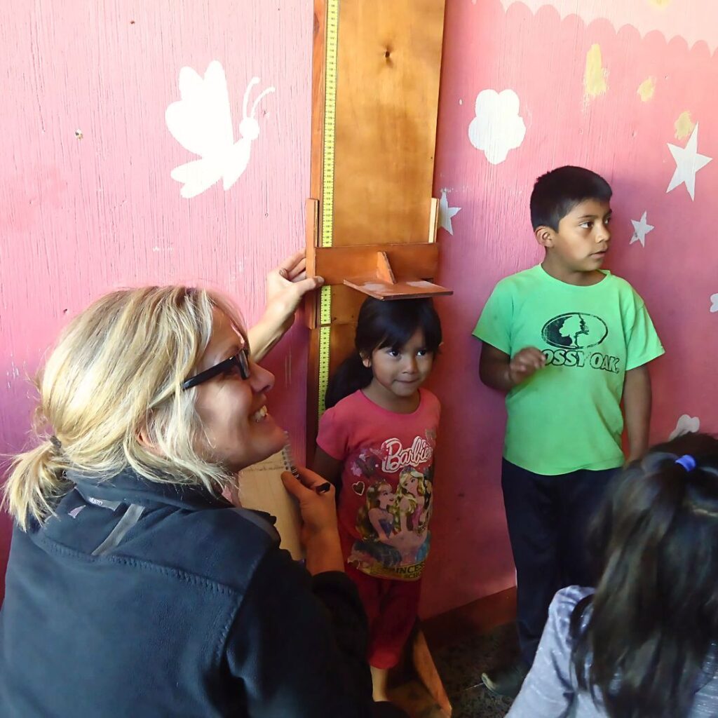Healthcare volunteer with children in Guatemala