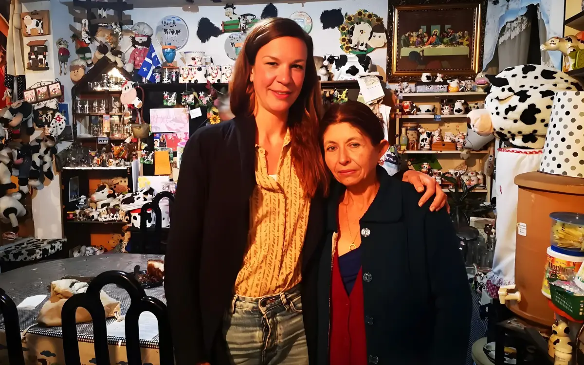 Young volunteer hugging an elderly Guatemalan woman and smiling