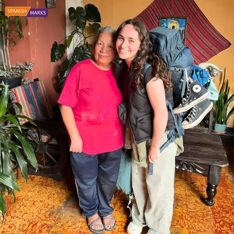 Volunteer smiling with her host family in Guatemala